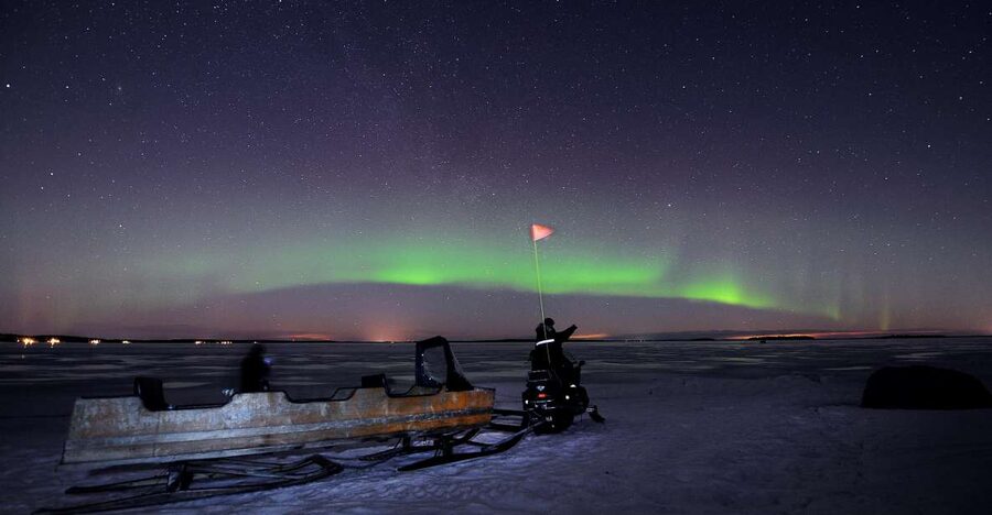 Luleå : Northern Lights Tour on a Snowmobile drawn Sled - Riding Between Islands on the Frozen Sea