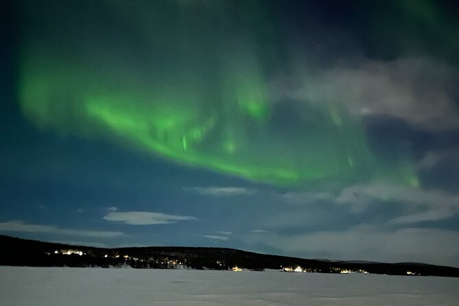 Northern Light snowmobile tour in Kiruna 7:30 pm - A stop at Jukkasjärvi church
