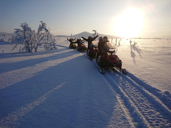 Snowmobile Safari to Lapland viewpoint - Lunch by the fire at Máttaráhkká Northern Light Lodge