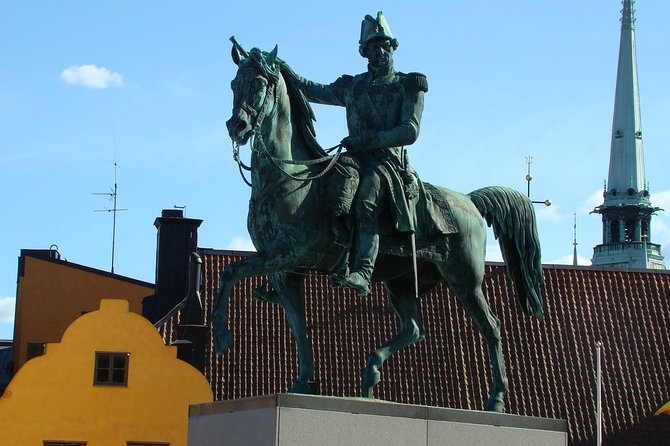 Stockholm Old Town and the Viking Museum, a Small Group Walking Tour - A tiny statue and Stockholm’s most famous square