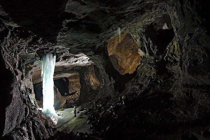 Underground Adventure Tour in Sweden - The Grand Hall, torches, music, and underground water